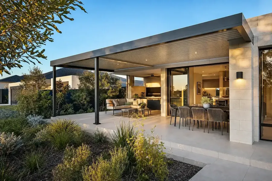 Australian-made steel flat-roof pergola over a paved alfresco at a modern Perth home